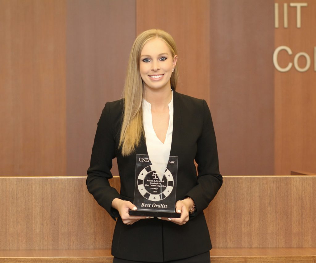 Rebecca Quade with the best oral advocate award from the Frank Schreck Gaming Law Moot Court Competition