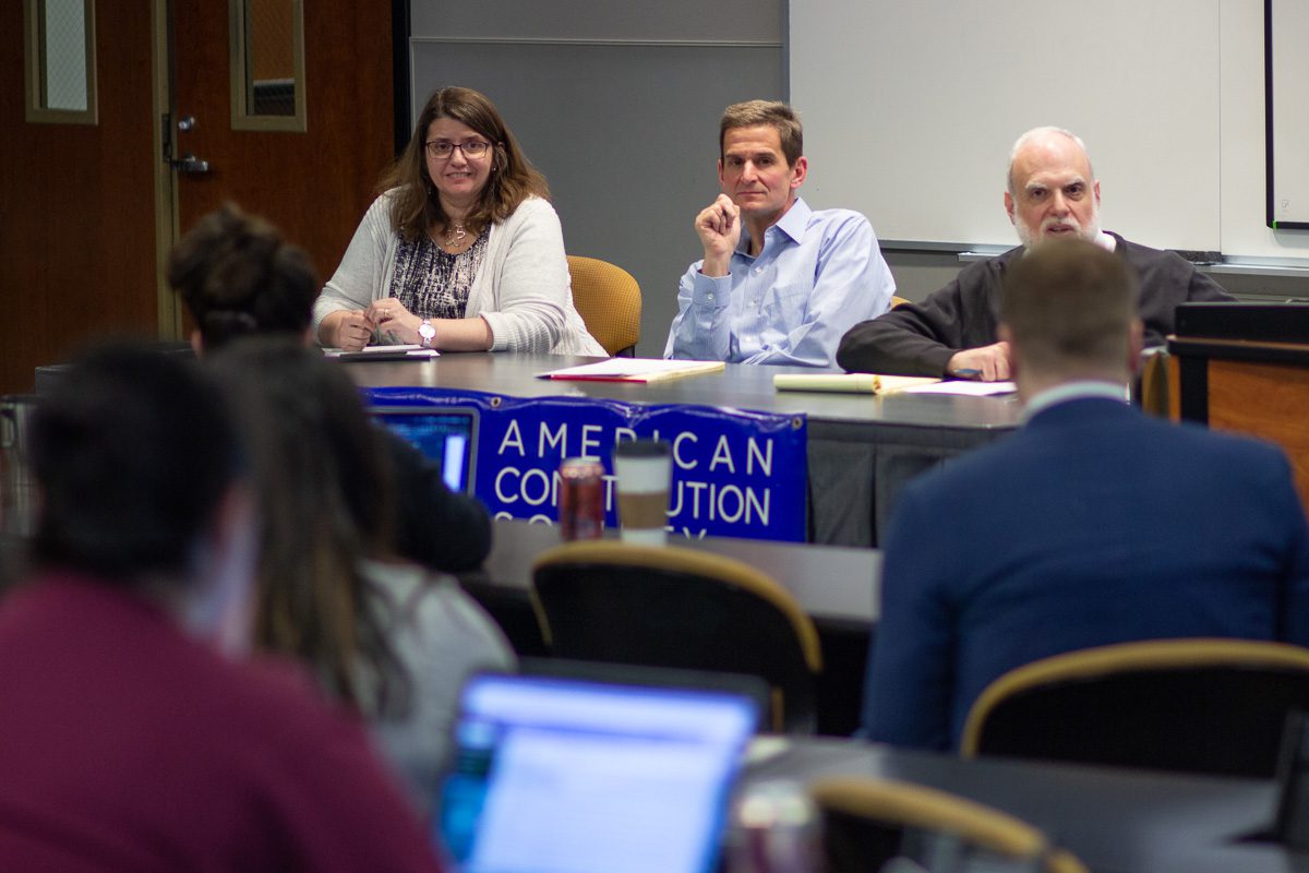 Chicago-Kent Constitutional Law professors answer questions about Impeachment at a student organization panel.